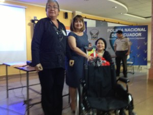 CCI presents a manual wheelchair to the police officers